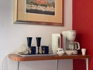 a table with a coffee maker on top of it at Guest House Amalija in Dubrovnik