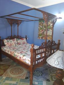 Säng eller sängar i ett rum på Coccobello Zanzibar