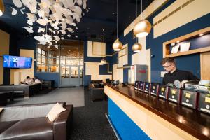 Телевизор и/или развлекательный центр в Park Hotel Latgola