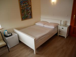 Łóżko lub łóżka w pokoju w obiekcie Słoneczny Dom pokoje i apartament na wynajem