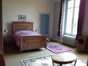 Krevet ili kreveti u jedinici u objektu Le Chateau du grand Coudray