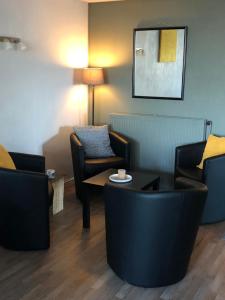 Posezení v ubytování Logis Hôtel l'Abricotine