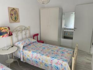 Postel nebo postele na pokoji v ubytování Casa Vacanze Nonna Maria