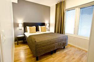 Säng eller sängar i ett rum på Holiday Club Åre Apartments