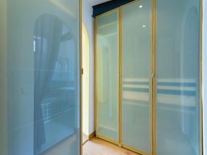 a glass door in a room with a balcony at Apartamento San Vicente by Toledo AP in Toledo