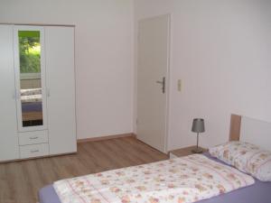 Ένα ή περισσότερα κρεβάτια σε δωμάτιο στο Ferienwohnung in Döbeln +9 φωτογραφίες