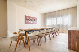 a conference room with a long table and chairs at Zahara Beach & Spa by QHotels - Adults Recommended in Zahara de los Atunes