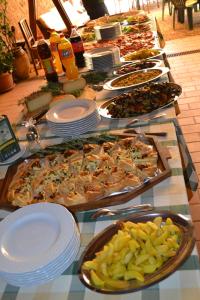 a buffet with many different types of food on a table at Colors Tastes in the Montagnola Senese in Valiano 