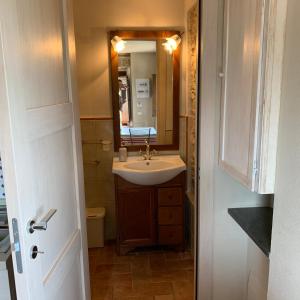 a bathroom with a sink and a mirror at Casa Dell'Angelo in Castelnuovo Magra +49 photos