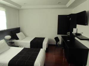 Ένα ή περισσότερα κρεβάτια σε δωμάτιο στο Hotel Classic
