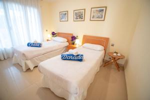 Ένα ή περισσότερα κρεβάτια σε δωμάτιο στο ARENDA Pino Alto Villa Poma
