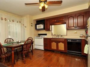 a kitchen with a table and a dining room at Second Street Suite in Clearfield