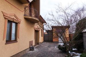 a building with a balcony on the side of it at ANNAMARI in Pavshyno