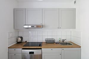 Kuchyň nebo kuchyňský kout v ubytování Ksiazat Pomorskich by Baltic Home