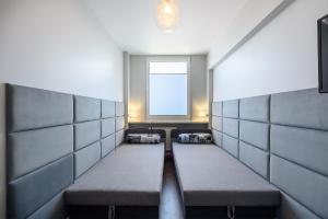 Posteľ alebo postele v izbe v ubytovaní ORION Downtown Apartment by PinPoint
