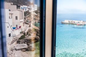 a view of the ocean from a window at Cala Dogana Guest House in Levanzo