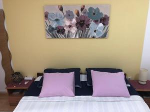 A bed or beds in a room at Apartments Veli Lošinj