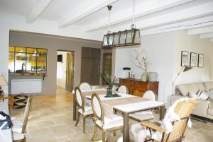 a dining room with a table and chairs at Les Coronilles in Saint-Maximin-la-Sainte-Baume