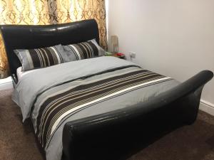 Ένα ή περισσότερα κρεβάτια σε δωμάτιο στο Alphalink Lodge