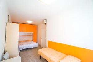 A bed or beds in a room at Residence Giuliana