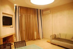 TV a/nebo společenská místnost v ubytování LESSIOTI APARTMENTS