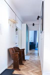 a living room with a chair and a couch at Kafka in Sandomierz