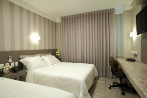 Кровать или кровати в номере Nohotel Premium Americana