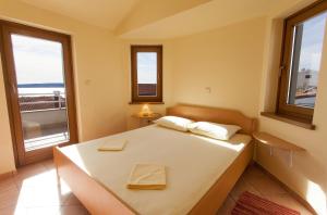 Ένα ή περισσότερα κρεβάτια σε δωμάτιο στο Apartman Vjekoslav