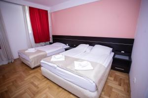 Letto o letti in una camera di Hotel Beograd - Yu