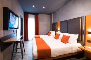 Łóżko lub łóżka w pokoju w obiekcie J24 Hotel Milano