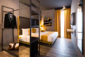 Łóżko lub łóżka w pokoju w obiekcie J24 Hotel Milano