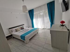 Un pat sau paturi într-o cameră la Vila Dan