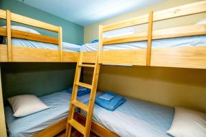 a bunk bed room with two bunk beds in it at Blue Palms Resort in Wildwood