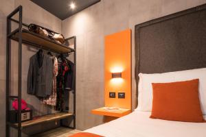 Łóżko lub łóżka w pokoju w obiekcie J24 Hotel Milano