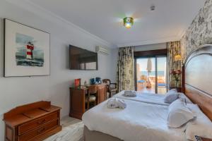 Postel nebo postele na pokoji v ubytování Hotel Playa de Regla