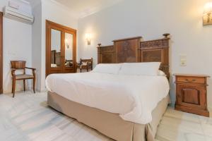 Postel nebo postele na pokoji v ubytování Hotel Playa de Regla