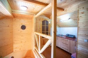 a log cabin with a staircase in a room at Synyogora in Yaremche +90 photos