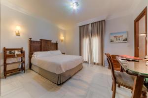 Postel nebo postele na pokoji v ubytování Hotel Playa de Regla