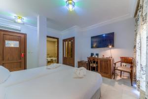 Postel nebo postele na pokoji v ubytování Hotel Playa de Regla