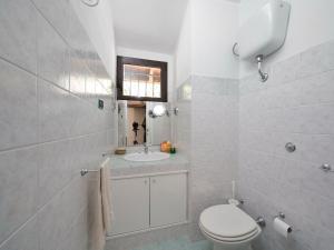 a bathroom with a toilet and a sink at Villa Ibisco in Chia +20 photos