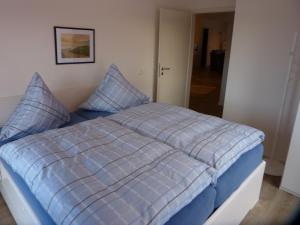 Postel nebo postele na pokoji v ubytování Büsumer Tide Segelmacherhuus Whg 10