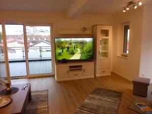 TV a/nebo společenská místnost v ubytování Büsumer Tide Segelmacherhuus Whg 10