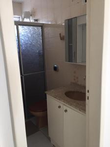 a bathroom with a shower and a sink and a toilet at Apto em ótima localização! in Lages