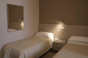 Postel nebo postele na pokoji v ubytování Magic Hotel