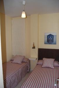 Кровать или кровати в номере Torre de la Galeona