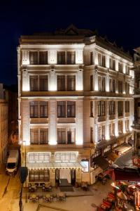 a large white building with lights on it at Mercure Istanbul Sirkeci in Istanbul