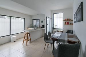 a kitchen and dining room with a table and chairs at FL 59 Coyoacan at your doorstep! in Mexico City