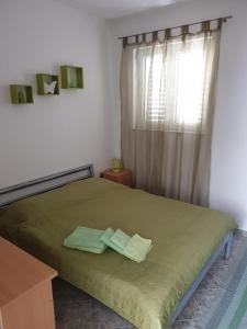 Łóżko lub łóżka w pokoju w obiekcie Apartments Victoria