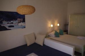 Ένα ή περισσότερα κρεβάτια σε δωμάτιο στο Esperos Hotel
