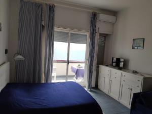 Cama o camas de una habitación en Scalea Beach Apartments